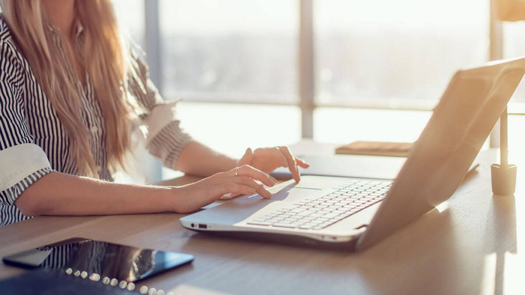 Female typing on computer - writing blog in 30 minutes
