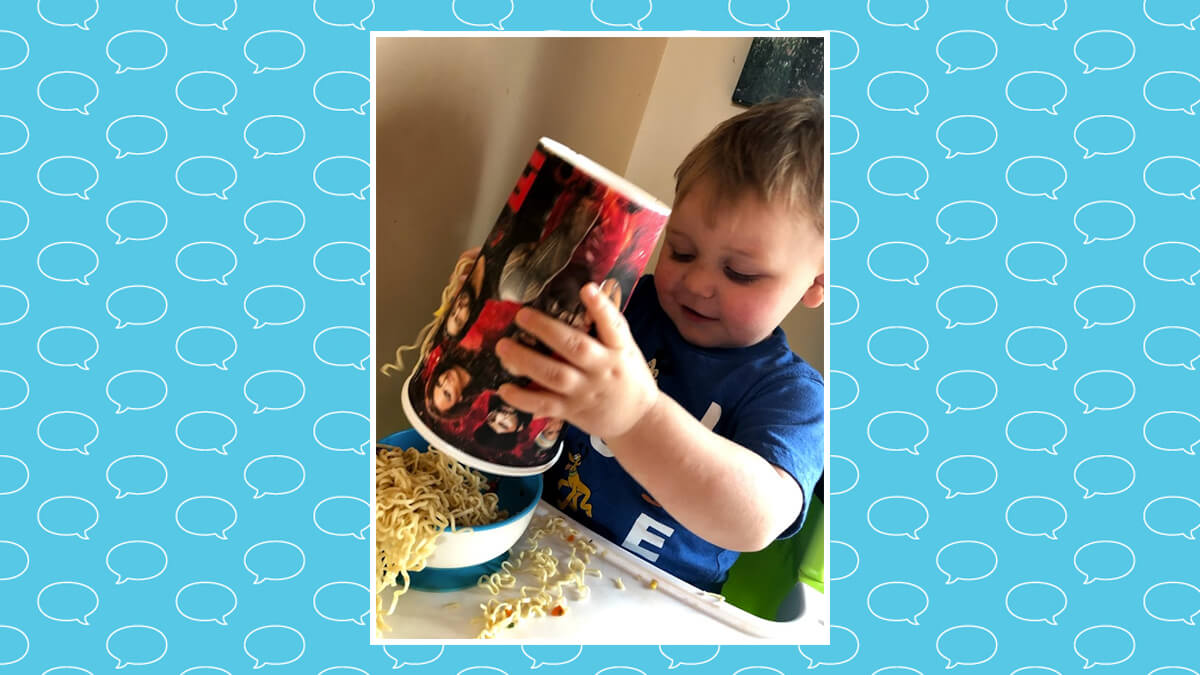 Miles making a mess with noodles