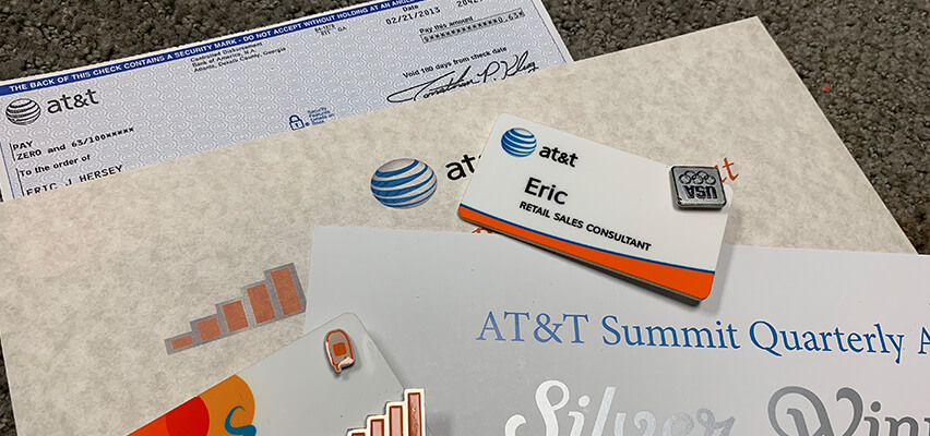 Eric Hersey and AT&T Awards, name tags, and small paycheck.